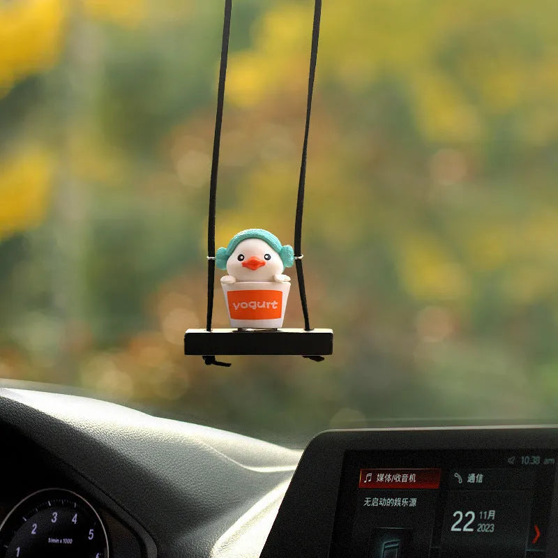 Yellow cartoon duck car hanging ornament in plastic, shown in four style variations.