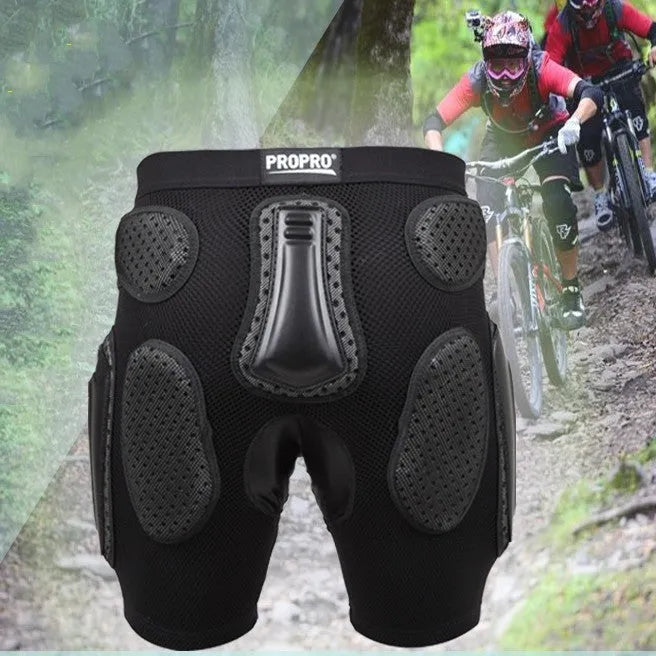 Black cycling protective pants with integrated hip pads, shown in size L for adult mountain bike or BMX use.