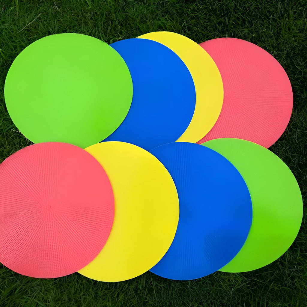Yellow 23cm diameter flat TPE football training marker disc on grass