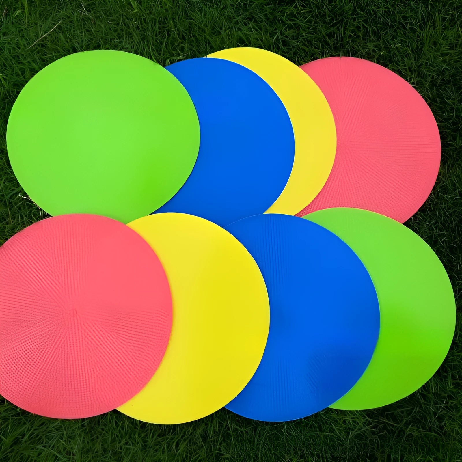 Yellow 23cm diameter flat TPE football training marker disc on grass