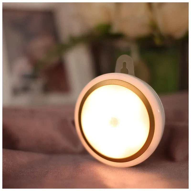 Circular white motion sensor LED night light showing diameter of 80mm with infrared sensor and five LEDs visible