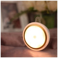 Circular white motion sensor LED night light showing diameter of 80mm with infrared sensor and five LEDs visible