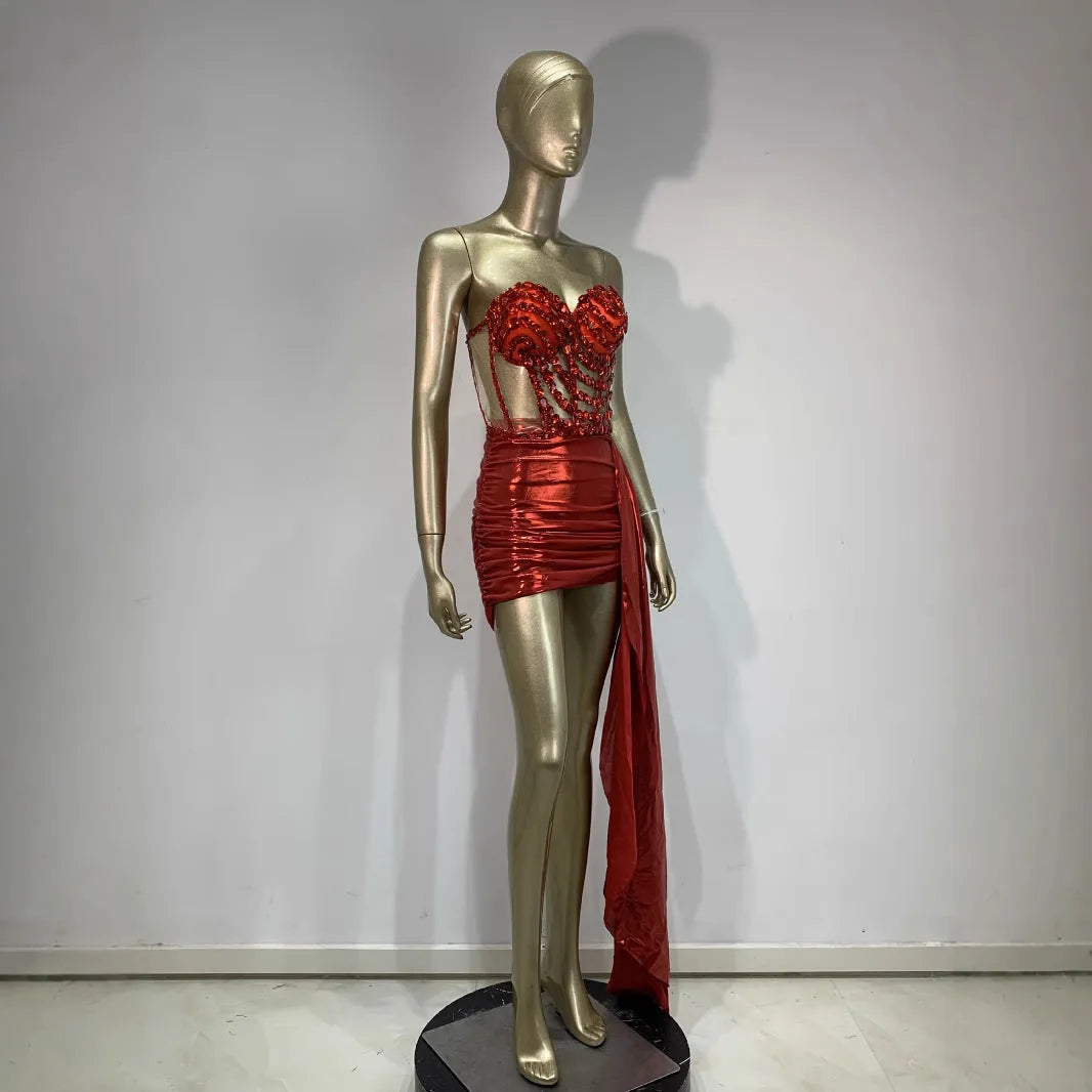 Red women's skirt suit with see-through mesh panels, a stage and party costume in stretch spandex.