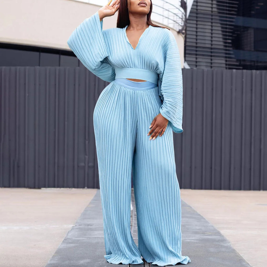 African suit two-piece set with batwing sleeve top and wide leg trousers in red or blue.