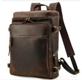 Large brown leather backpack with zipper closure, under 20L capacity