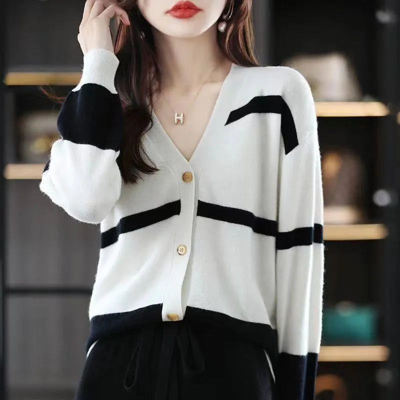 Women's striped V-neck cardigan with a raised 3D pattern, shown buttoned.
