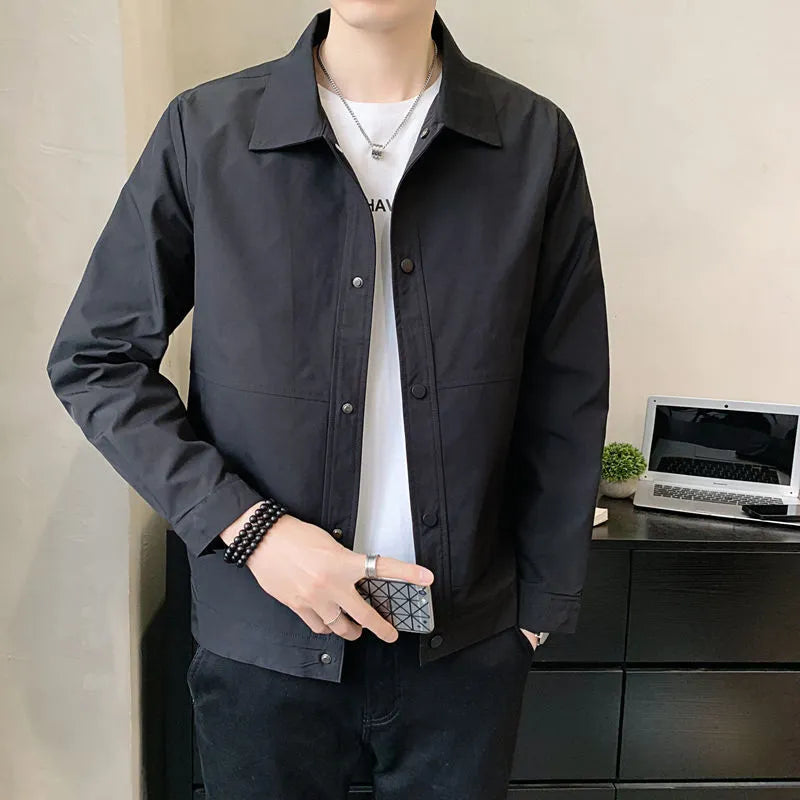 Man wearing a thin, single-layer Korean style jacket in light gray for spring or autumn.