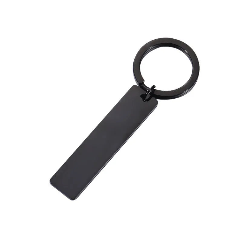 Stainless steel keychain with laser-engraved Spotify code in rose gold finish, rectangular pendant