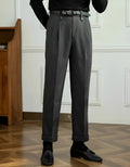 Grey straight-leg high-waist casual trousers laid flat, showing relaxed fit and front detail.