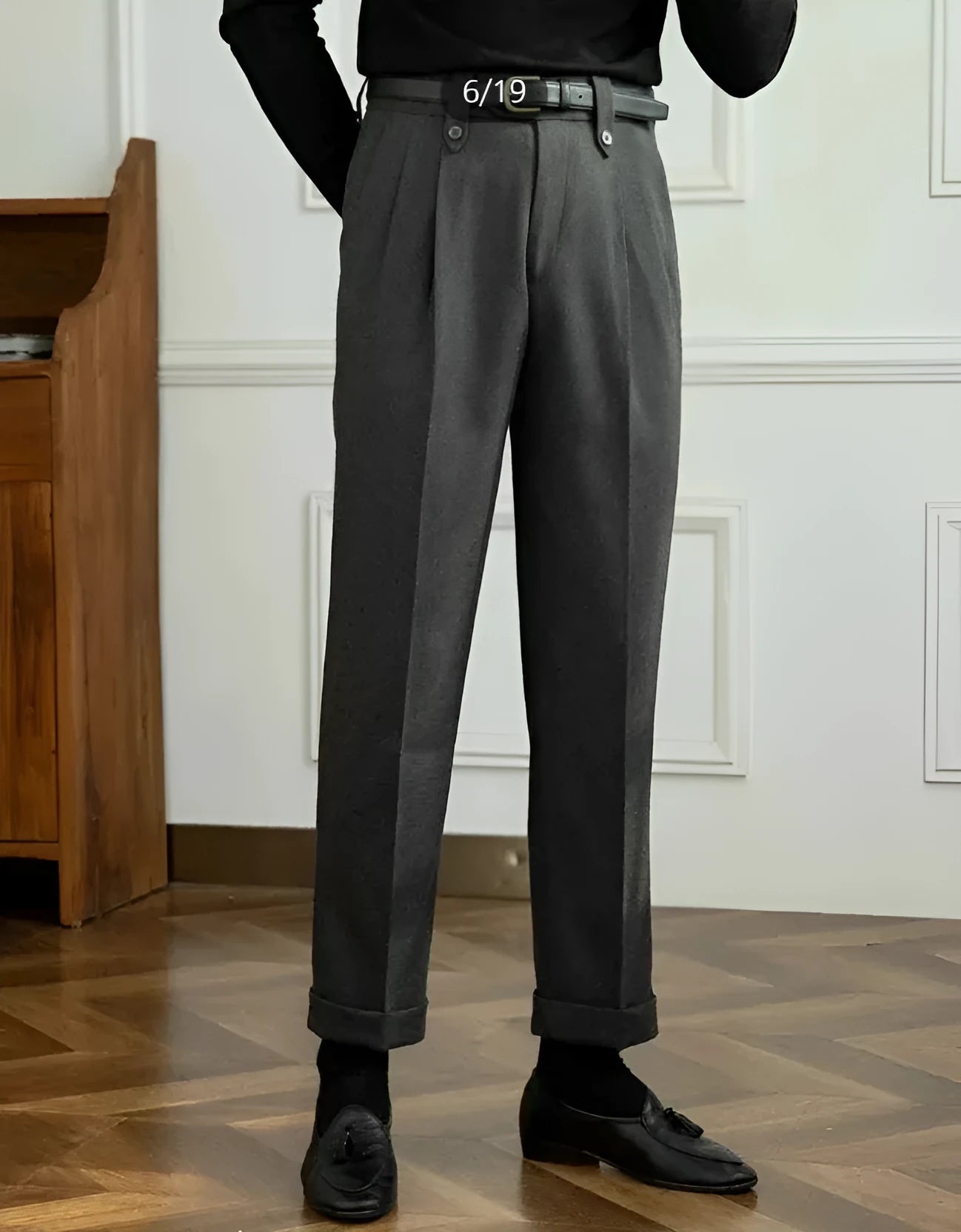 Grey straight-leg high-waist casual trousers laid flat, showing relaxed fit and front detail.