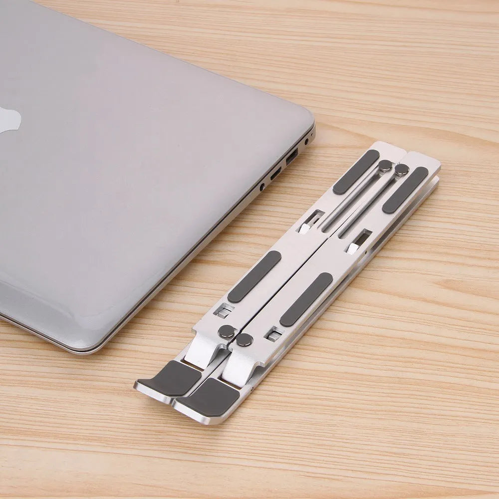 Silver cooling folding computer stand made of aluminium alloy and silicone pads for laptops under 16 inches