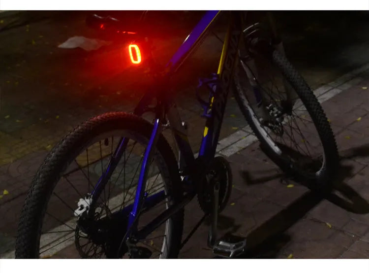 Meilan X6 LED bicycle tail light with PC+ABS body, 900 mAh battery, and rubber band mount