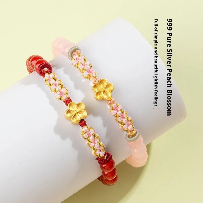 Hand-woven red rope bracelet with diamond crystal and peach blossom design
