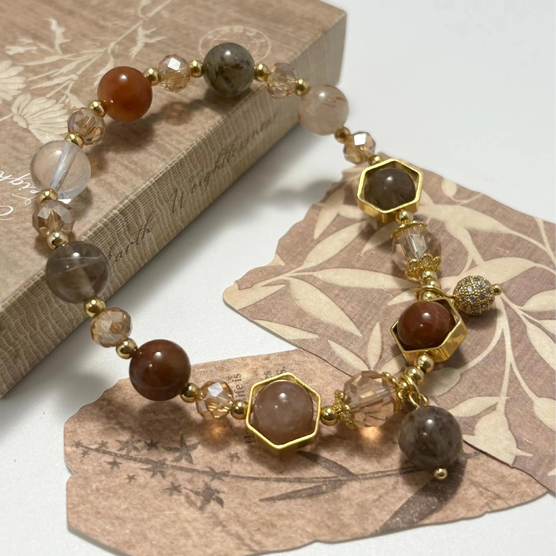 Gold-coloured hand-woven citrine bracelet with auspicious symbols and 8mm beads.