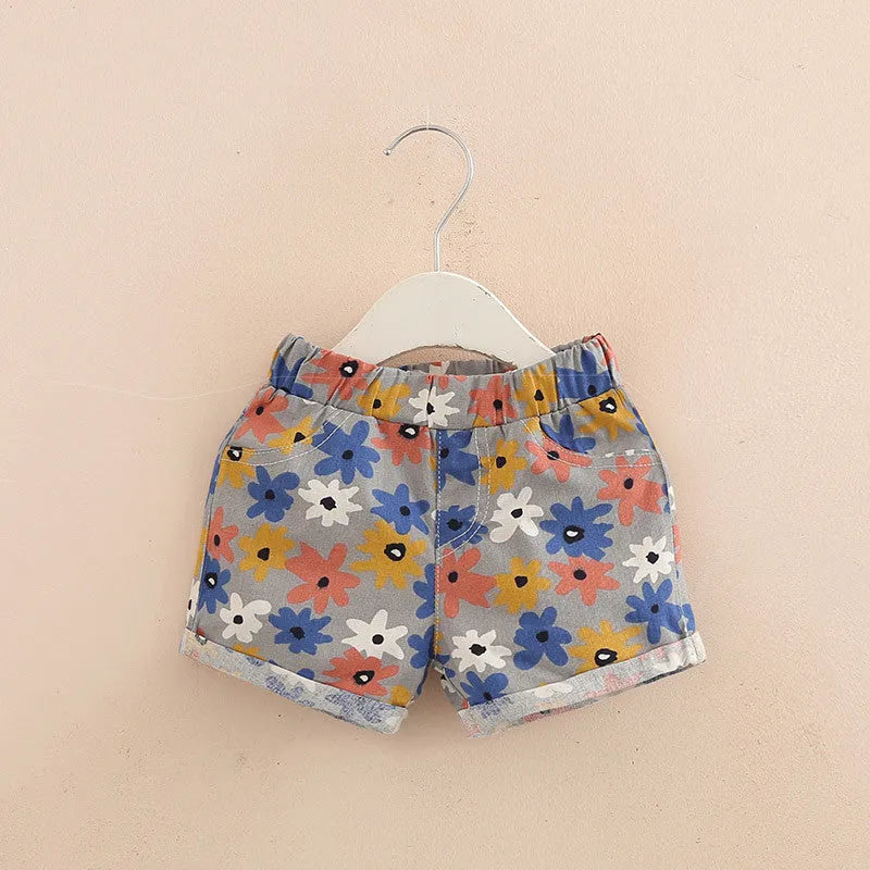 Girls casual elastic waist summer shorts in sky blue striped yellow flower pattern, size 120cm