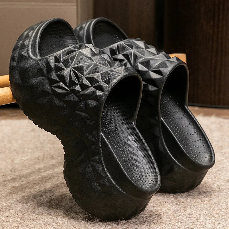 A pair of khaki high heel flip flop slippers made from injection moulded EVA with a thick sole.