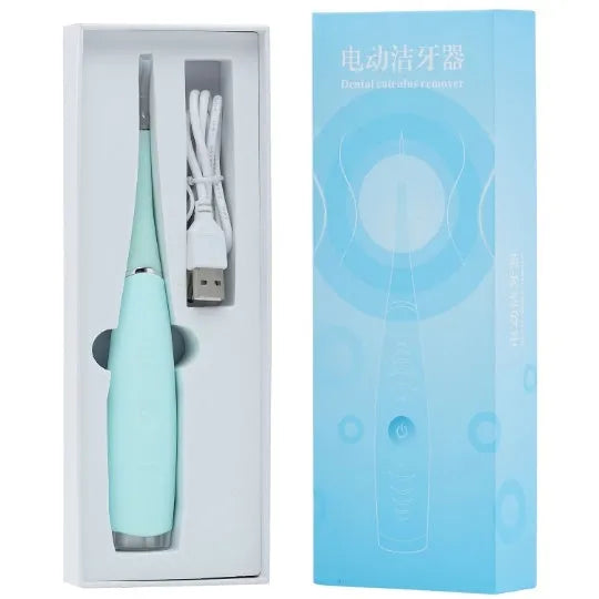 Pink and blue waterproof electric dental scaler with silicone handle and charging cable on a bathroom counter.