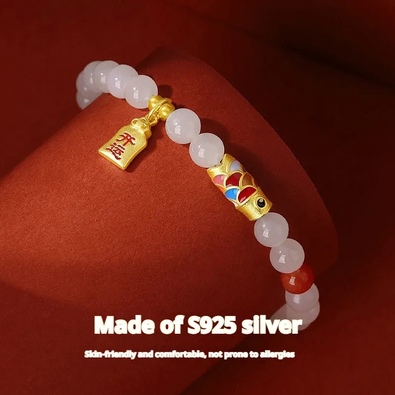S925 sterling silver bracelet with a blue cold enamel and natural Hetian jade koi fish charm.