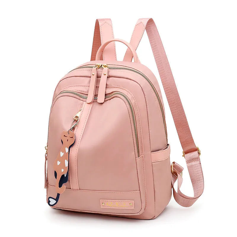 A black soft nylon women's casual travel backpack with double straps and multiple internal compartments.