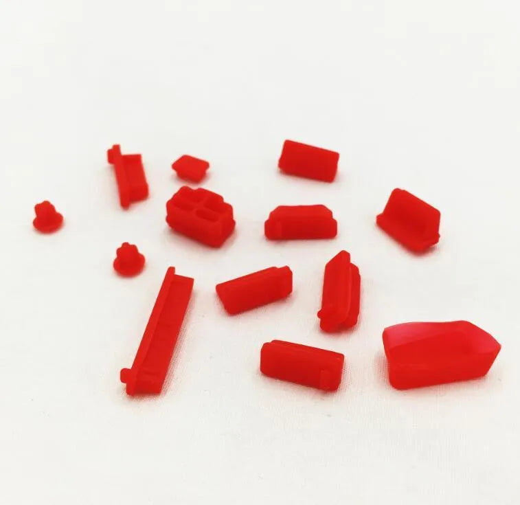 13-piece silicone dust plug set for laptop ports in multiple colours including transparent and black