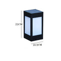 Set of four different styles of solar-powered LED garden lights for outdoor use.