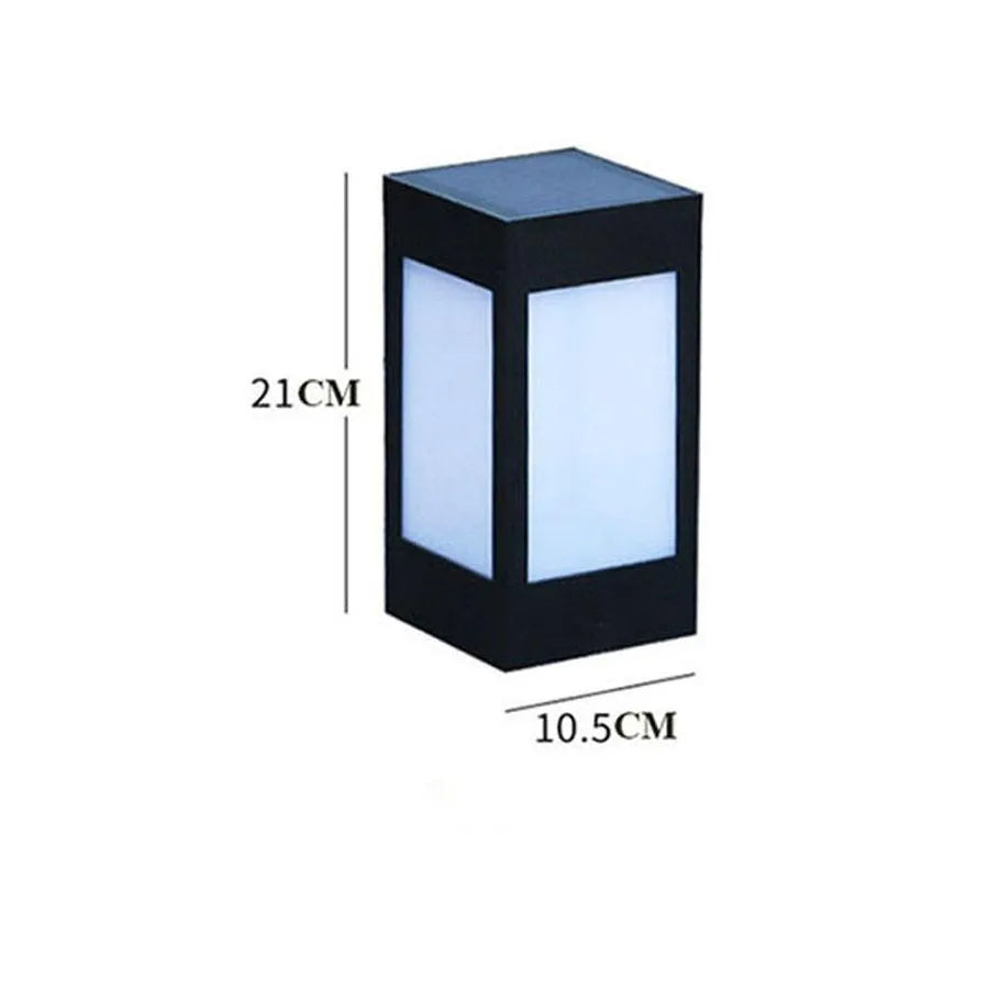 Set of four different styles of solar-powered LED garden lights for outdoor use.
