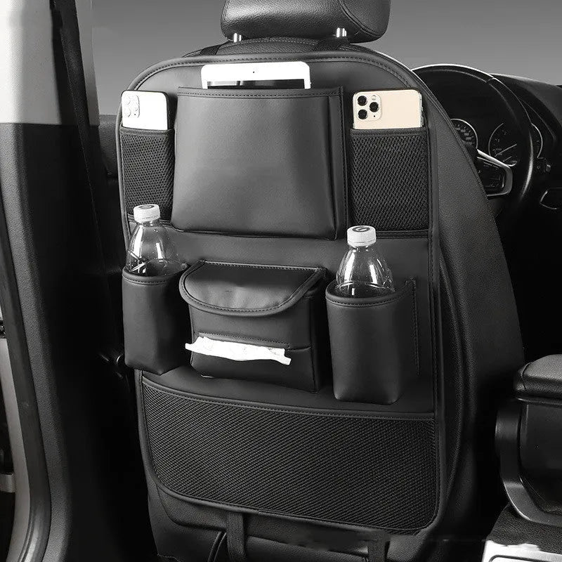 Black PU leather car seat back storage bag hanging on a grey car seat headrest.