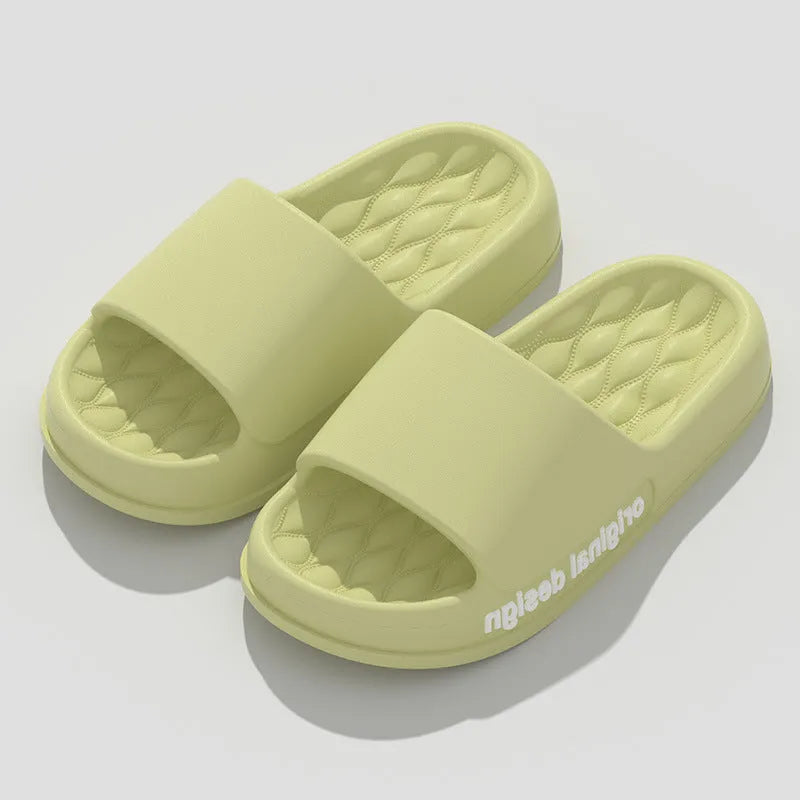 Pair of simple EVA slippers in black on a light background