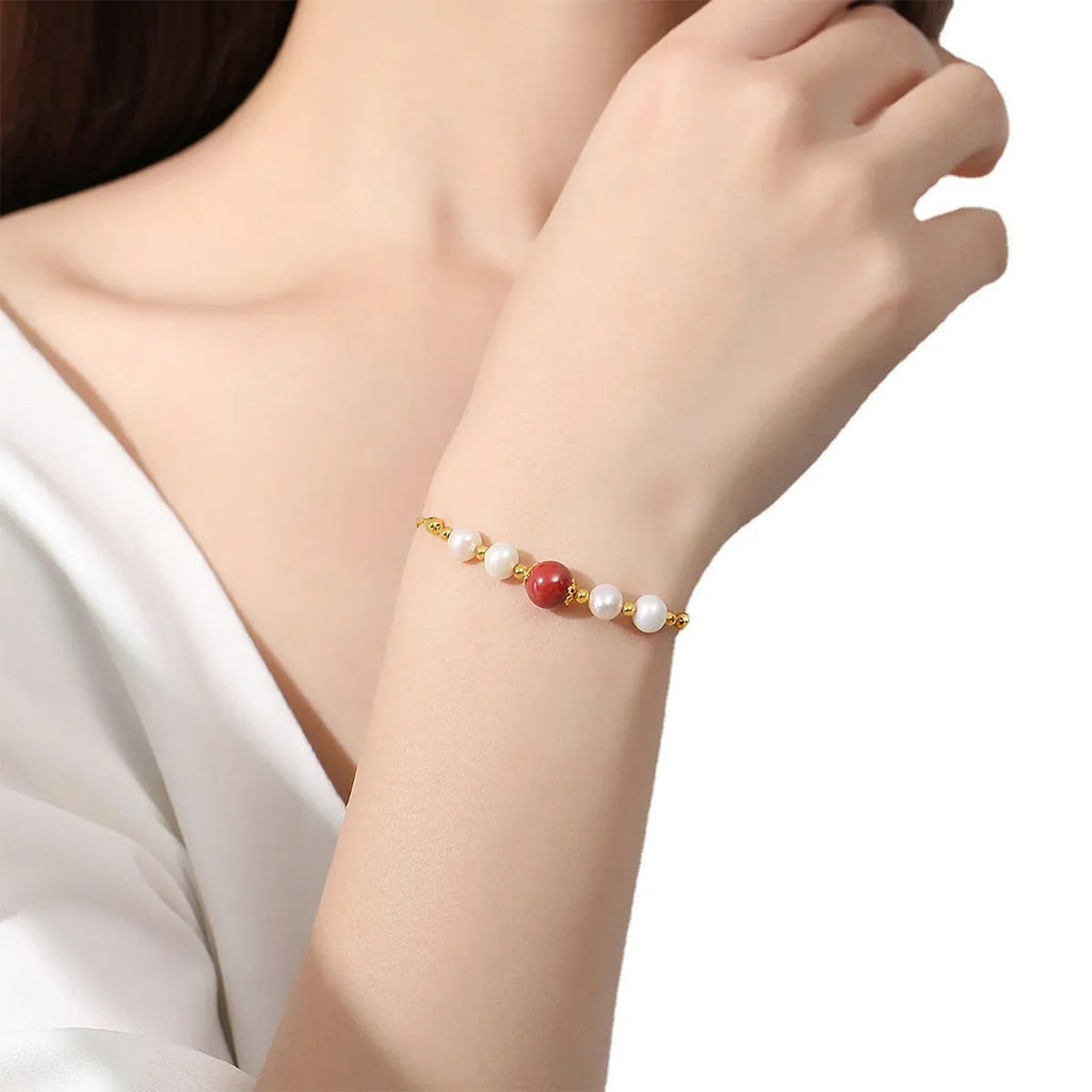 Yellow-finished 925 silver bracelet with red bean and pearl beads in retro style for women
