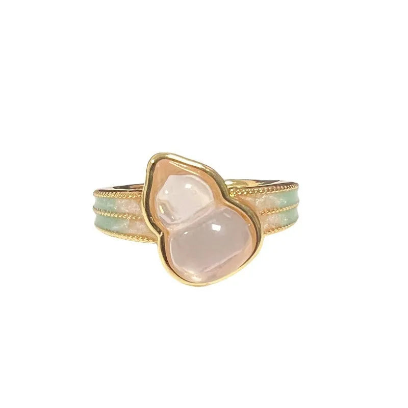 Close-up of a vintage-style adjustable copper ring with a gourd and floral design in a zircon inlaid finish.