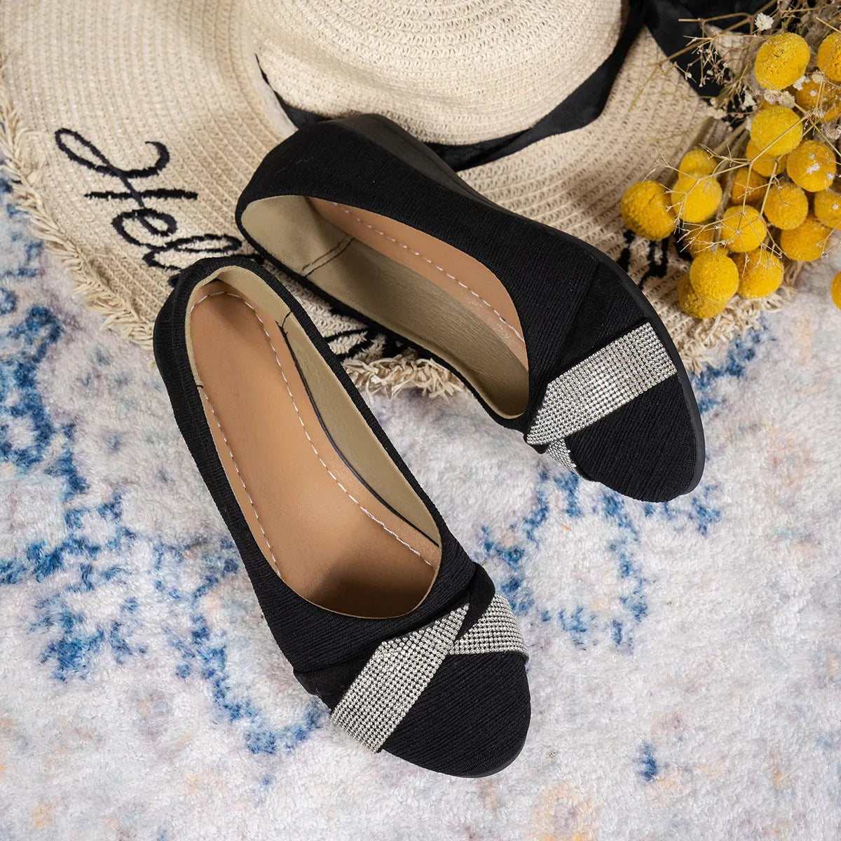 Women's black slip-on casual shoes with rhinestone decoration and a chunky heel.