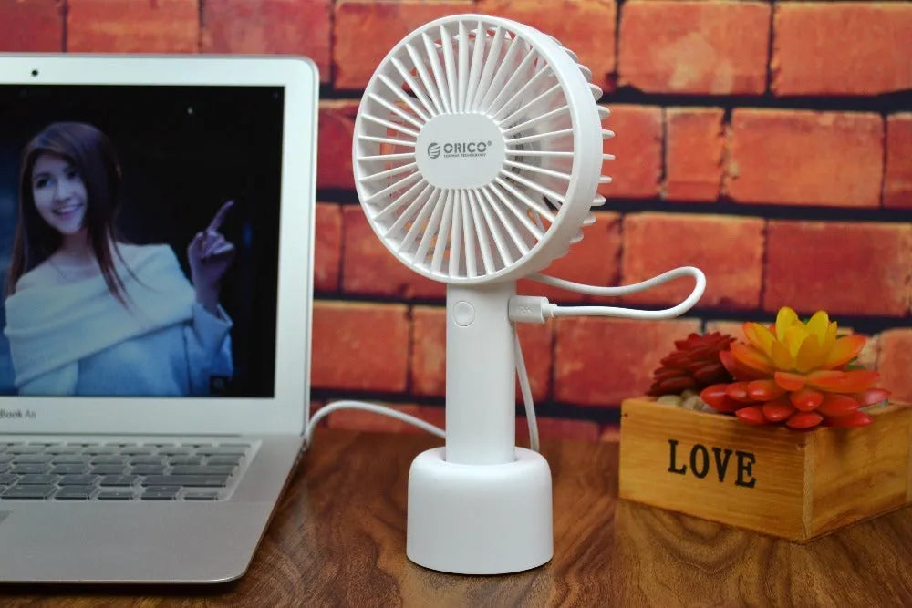White ORICO FH1 USB rechargeable portable desktop fan with three-speed settings.