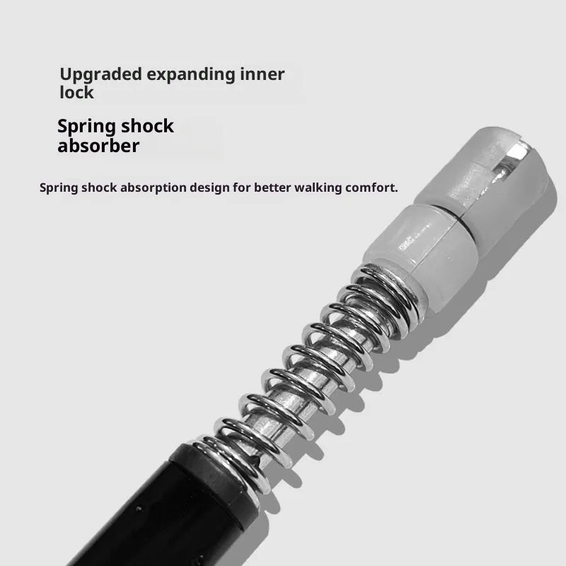 Silver four-section aluminium alloy alpenstock with curved handle, extended to full height on outdoor trail