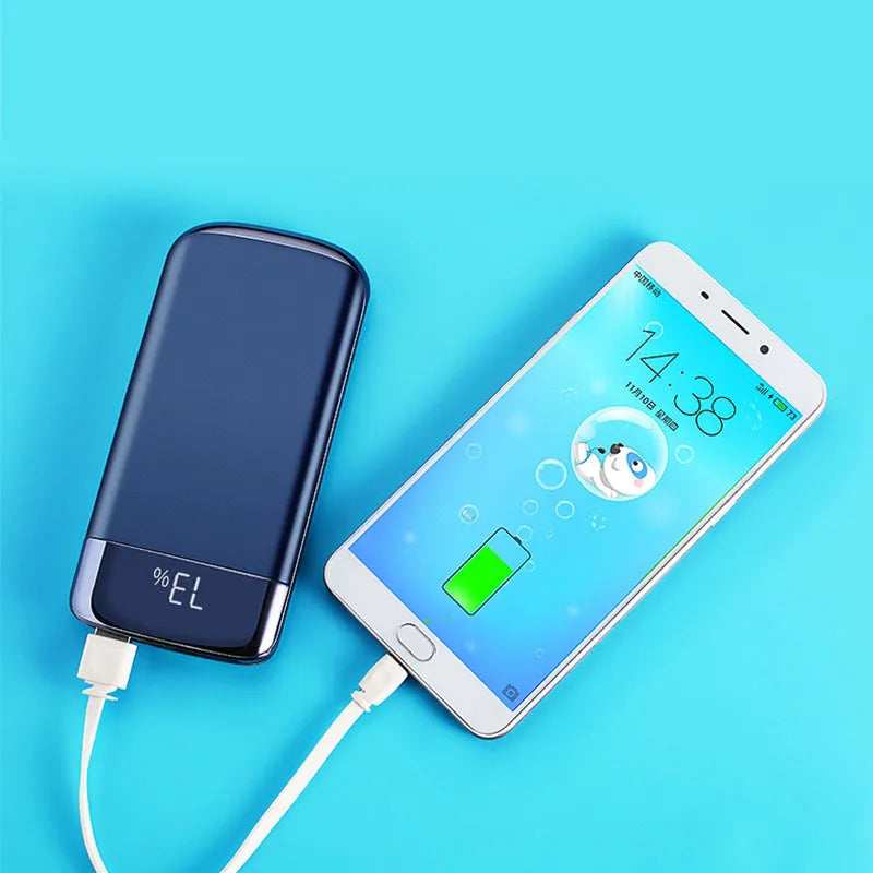Black portable power bank with LCD display showing battery percentage and two USB ports