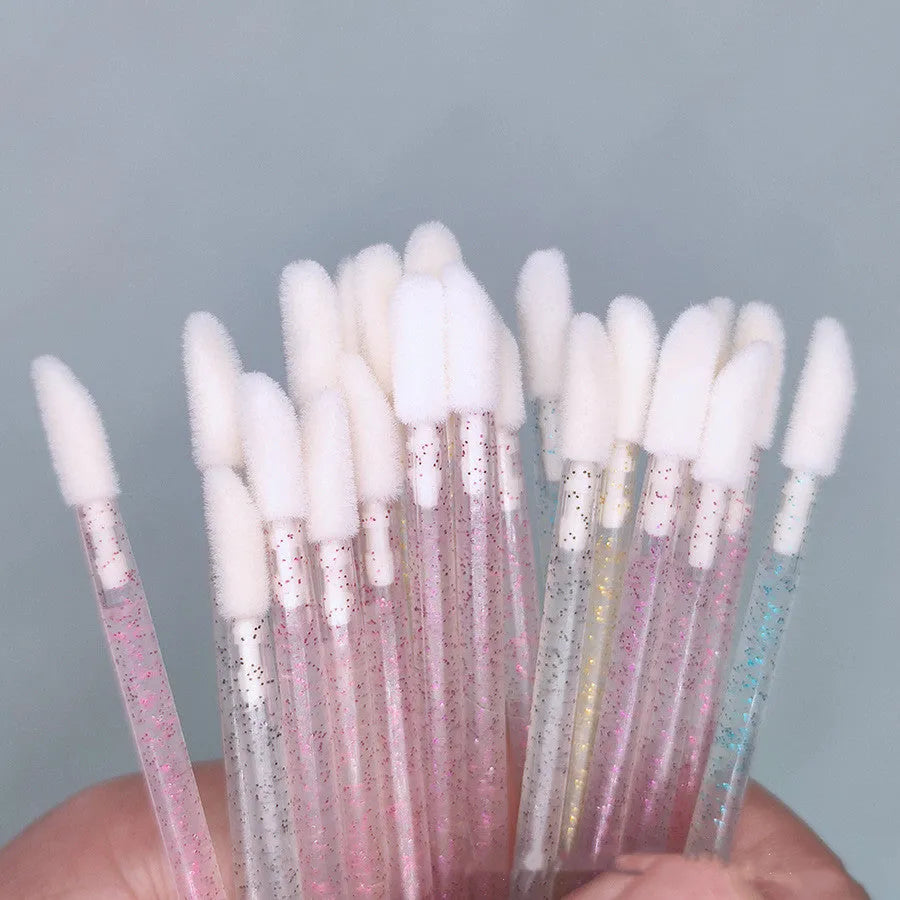 Crystal rod lip brush with man-made fibre bristles, 9cm total length, red colour, on white background