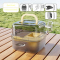 Transparent plastic outdoor hamster portable travel cage with platform water dispenser running wheel on a flat surface