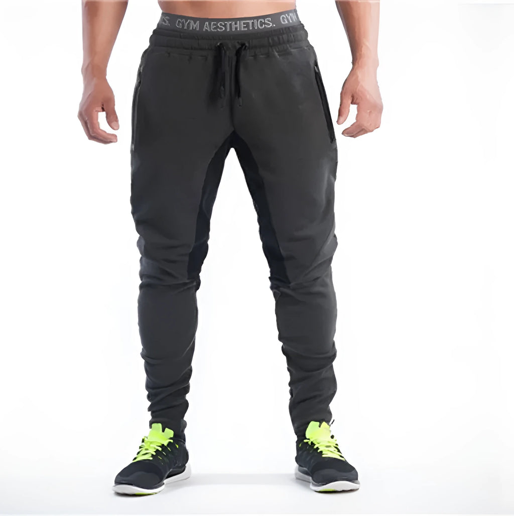 Men's slim-fit cotton sweatpants in grey black with elastic waistband and tapered leg