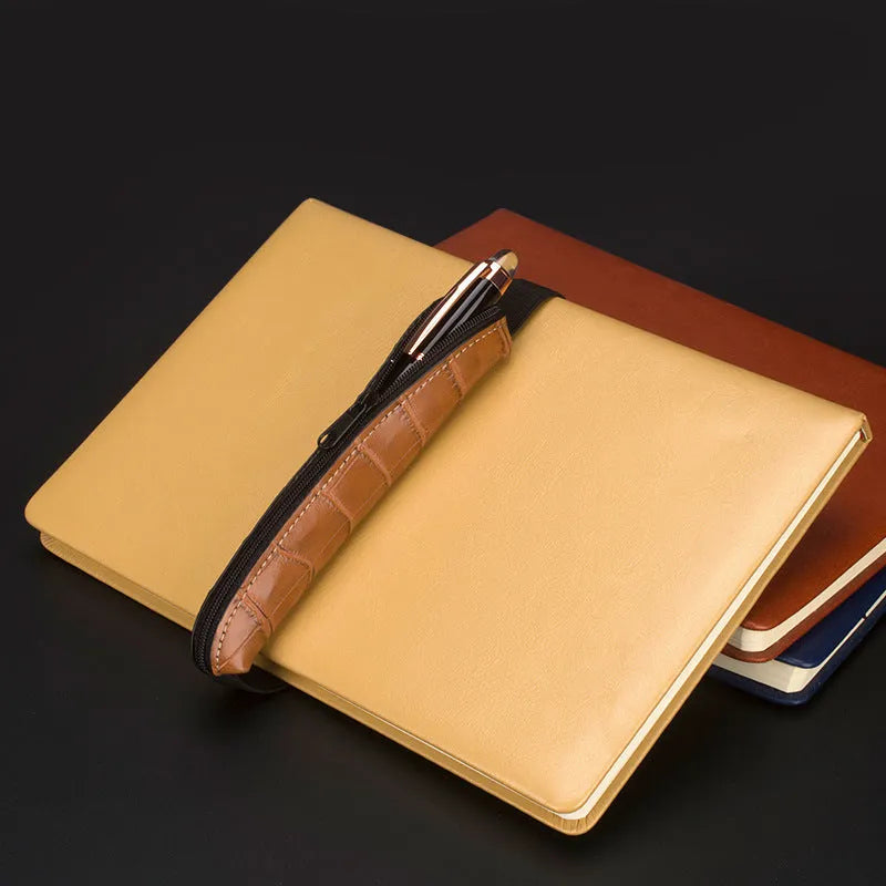 Slim 16.5cm long PU leather office pencil case in beige grey on a desk