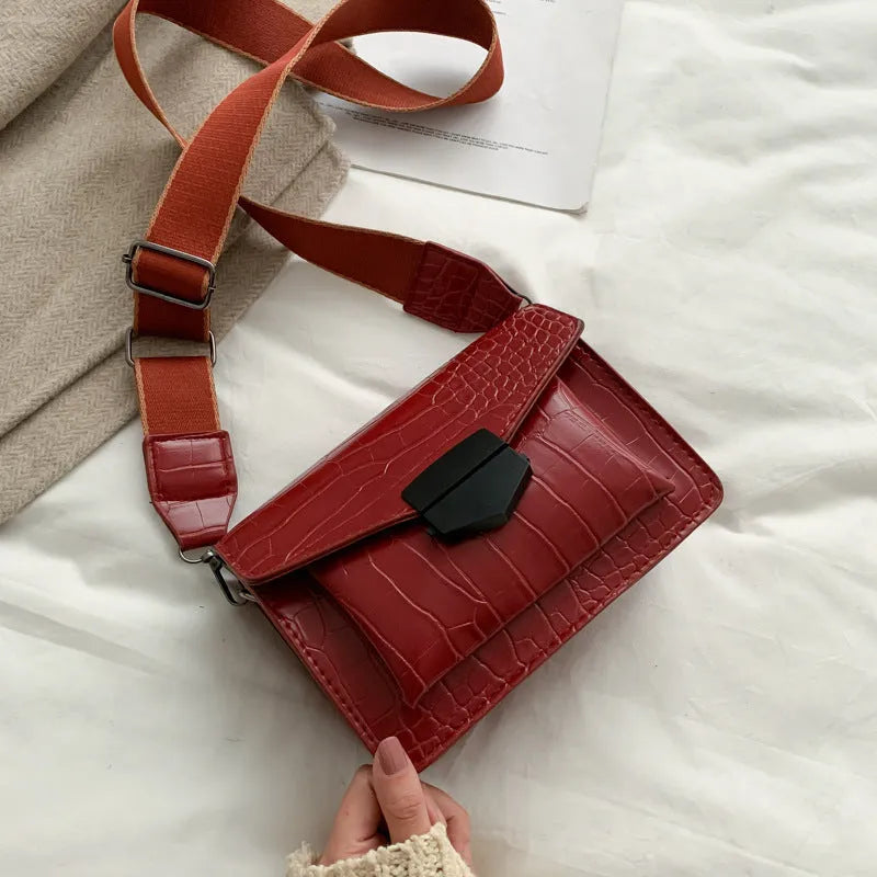 Vintage PU leather crossbody bag shown in black, dimensions 20cm by 14cm.