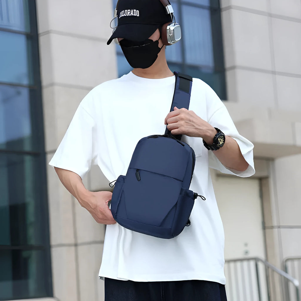Grey waterproof polyester chest bag for men showing shoulder strap and main compartment