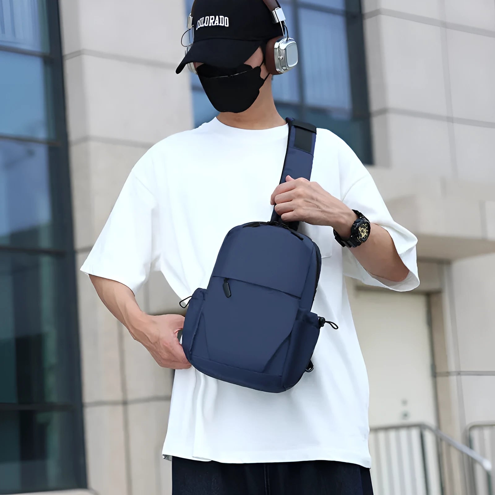 Grey waterproof polyester chest bag for men showing shoulder strap and main compartment