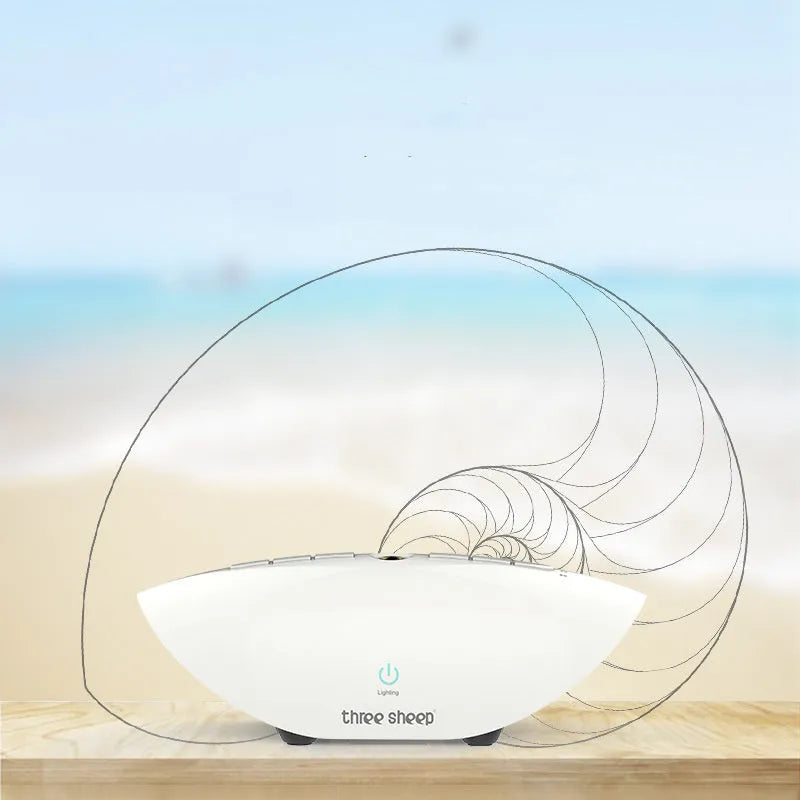 White noise sleep aid machine with mechanical buttons in white finish showing timer and volume controls