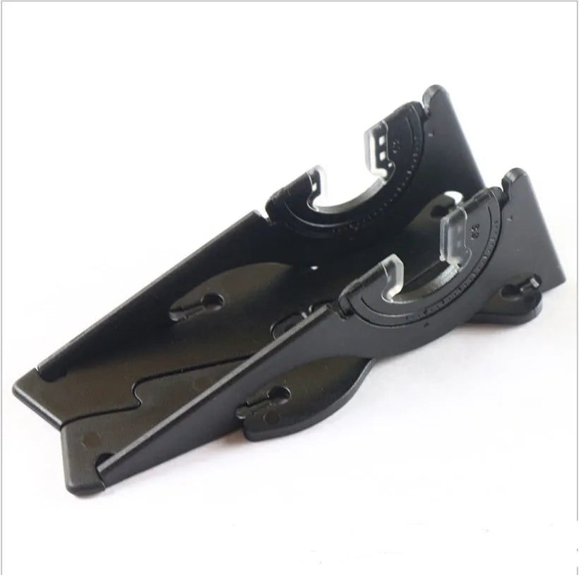 Plastic card type mobile phone holder in various colours on a desktop.