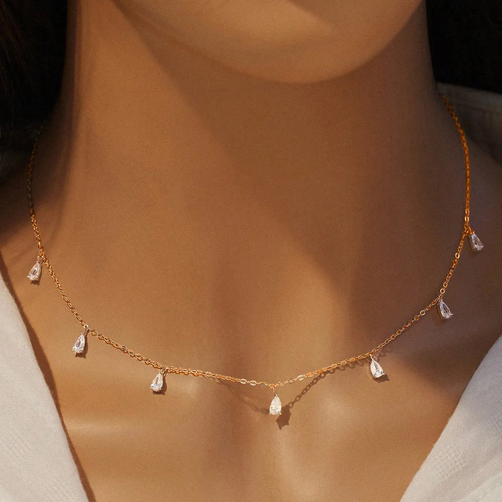 Women's silver drop-shaped artificial zircon necklace on an O-shaped chain, shown in rose gold, golden yellow and silver finishes.