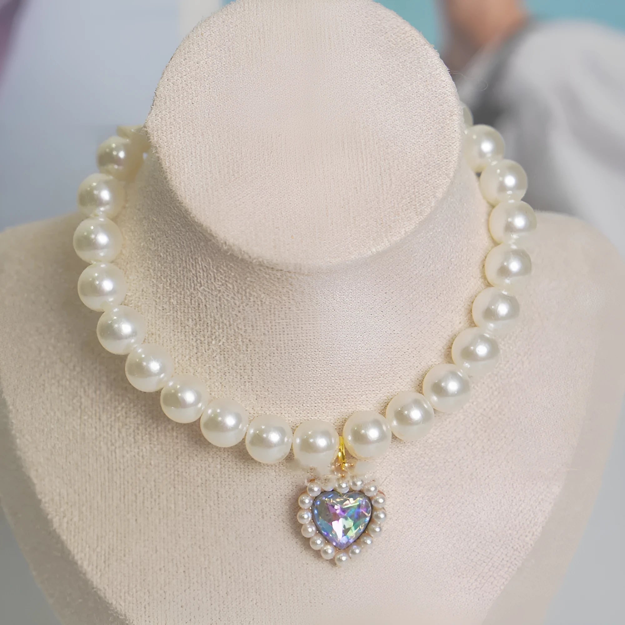 Decorative cat collar with plastic alloy resin construction and central gemstone charm in multiple colour options