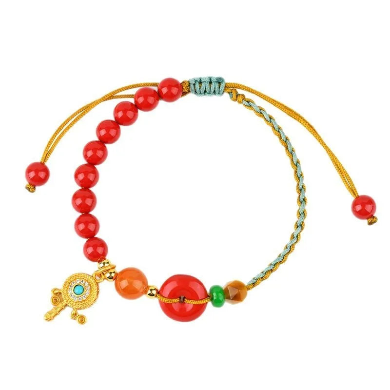 Hand-woven cinnabar peace buckle bracelet in emperor red sand colour with geometric design