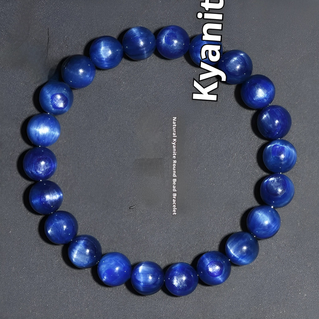 Polished blue geometric crystal bracelet with Ruyi design elements on a wrist.