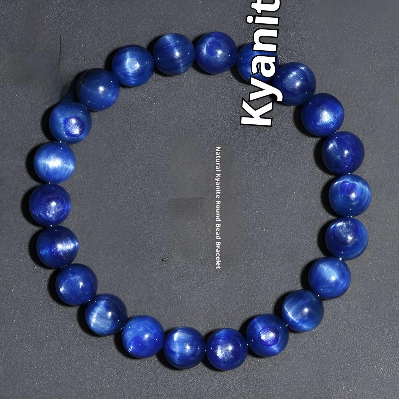 Polished blue geometric crystal bracelet with Ruyi design elements on a wrist.