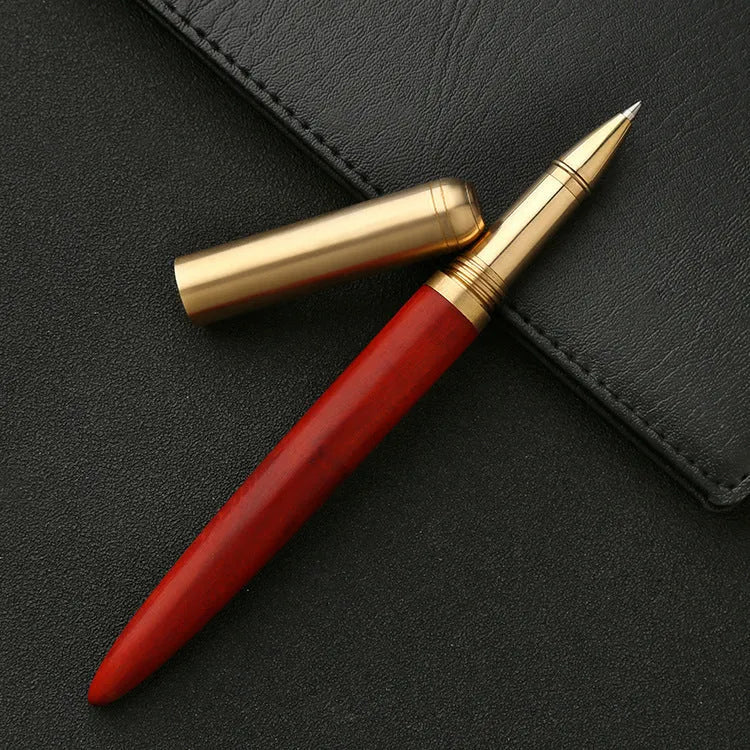 Brass and sandalwood signature pen showing wood grain and metal details at 14cm length
