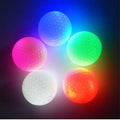 Glow Ball strobe golf ball on grass, random colour, 4.3 cm diameter